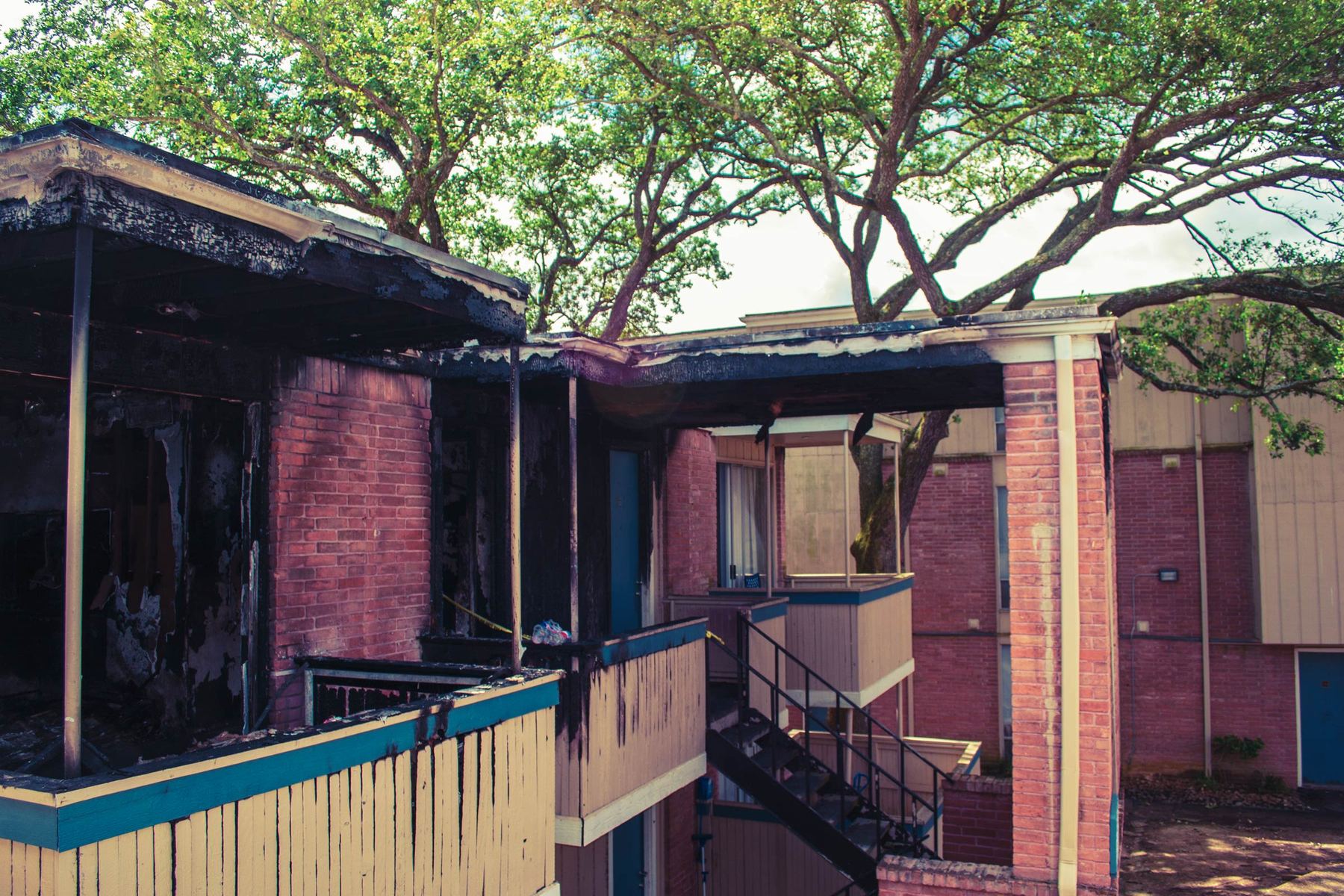 Apartment building after a fire with charred balconies